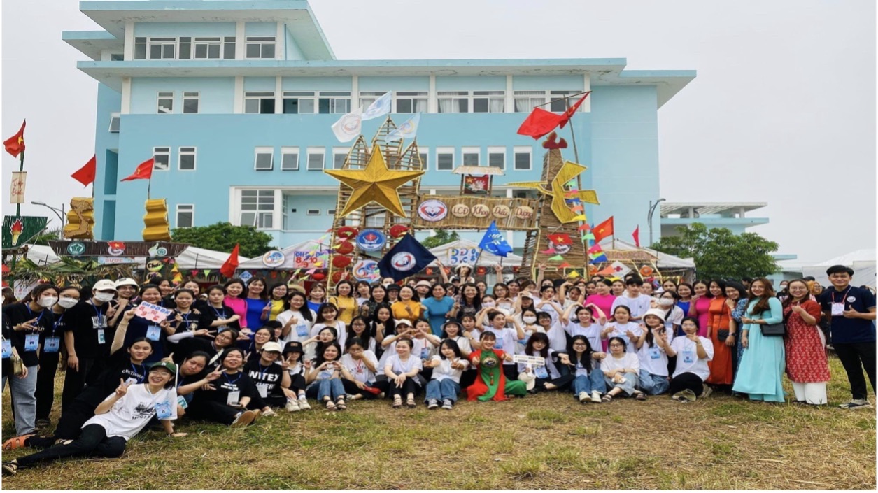 A group of people posing for a photoDescription automatically generated